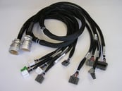 Custom test cable harness for portable automotive audio system tester.