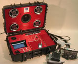 Portable suitcase tester for automotive audio systems that is designed to emulate production functional test environment.