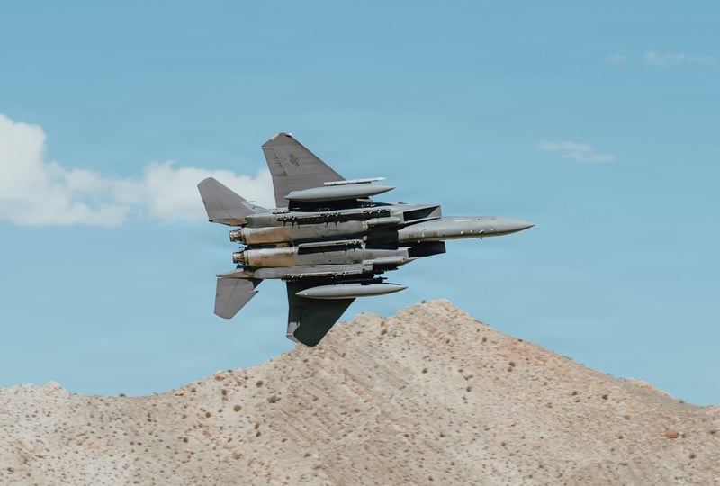 F15 jet over mountains