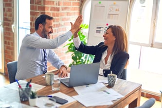 high five between coworkers